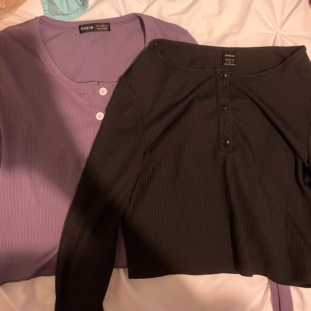 2 crop tops, one black and one purple